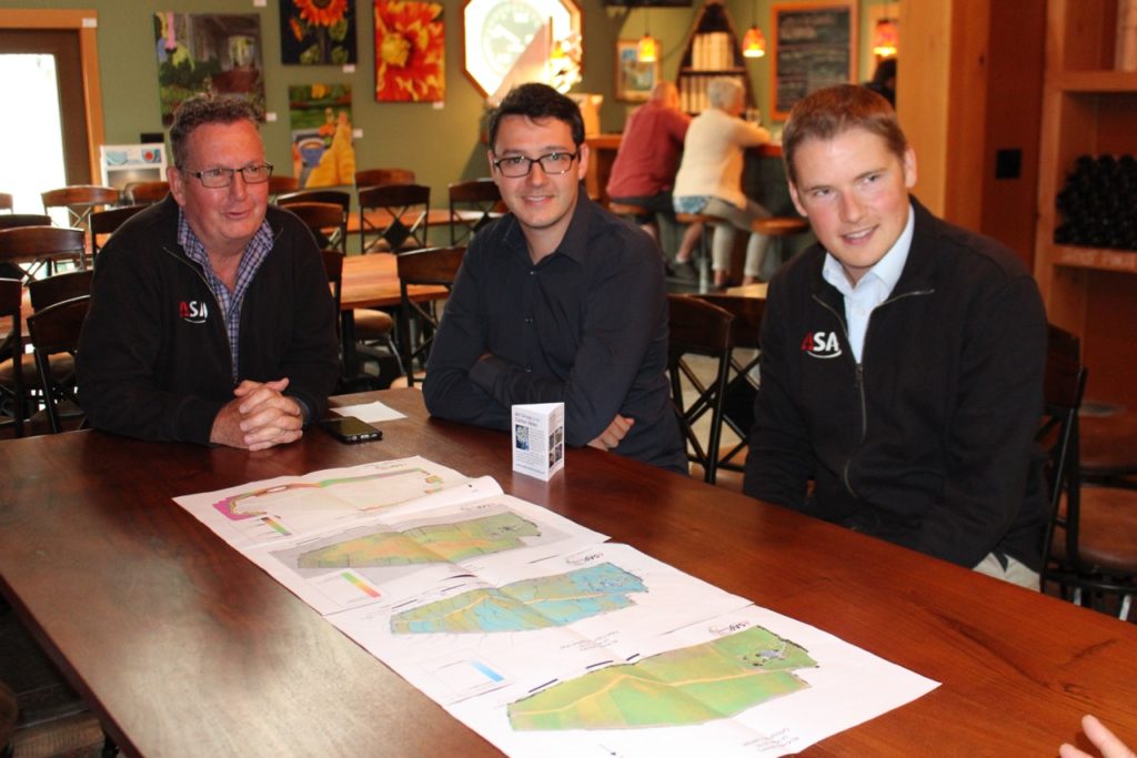 Mark Sylvester, Alex Sylvester and John Carley of ASAP Geomatix reviewing the maps for 40 Knots Vineyard.