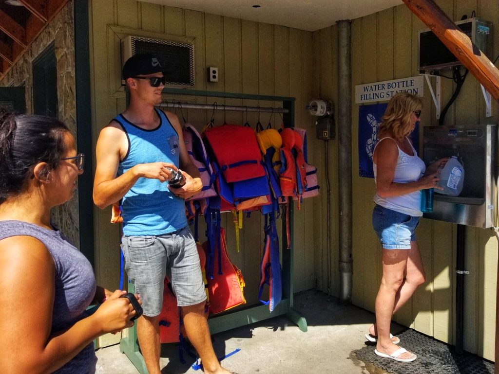 guests at the Lakeside Resort in Oliver, BC using a water bottle refill station instead of using single-use plastic bottles