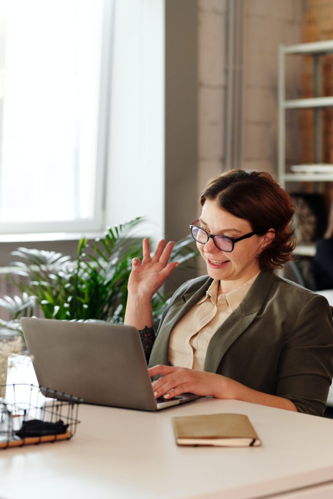 image of a woman interacting in a virtual event while working from home